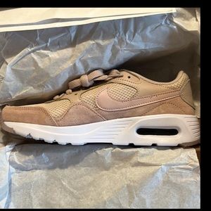 Size 7 Brand new woman’s NiKE sneakers in the box.  Never worn